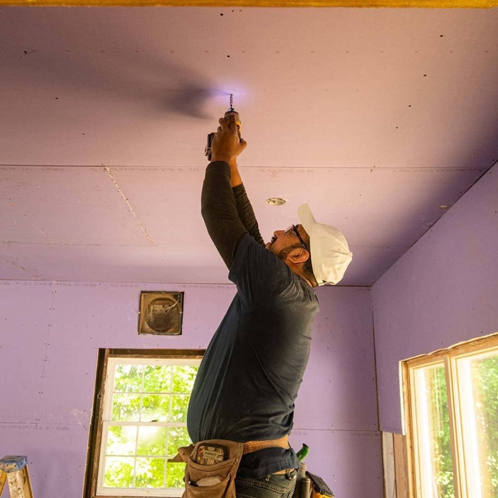 Impact-resistant gypsum board wall for commercial corridor in Doha