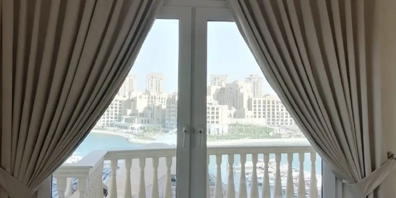 Blackout curtains installed in a Doha, Qatar living room