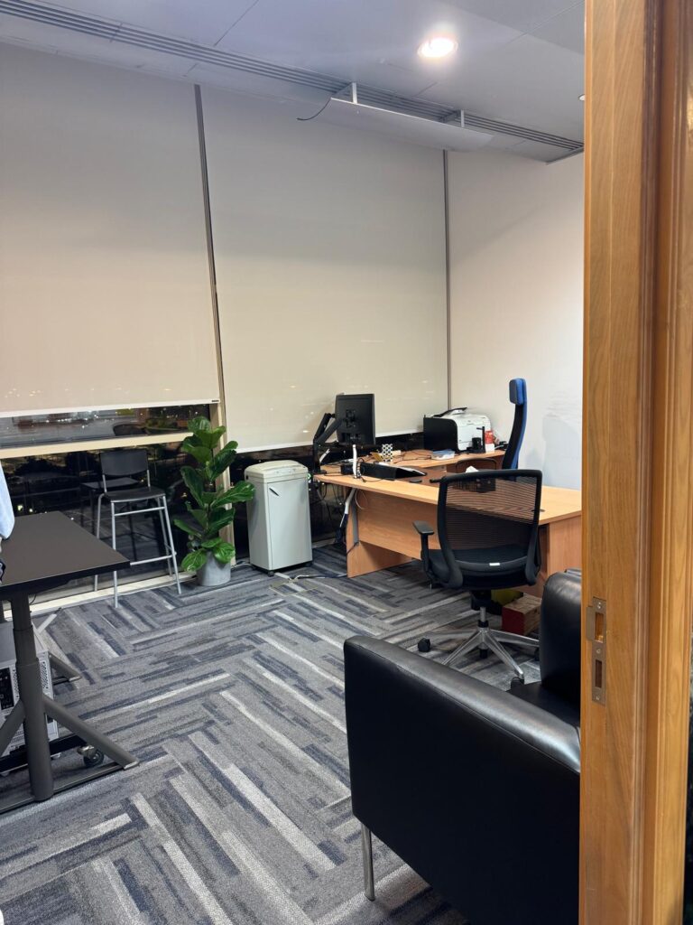 Custom roller blinds installed in a modern interior