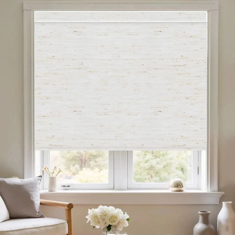 Professional installation of roller blinds on a window