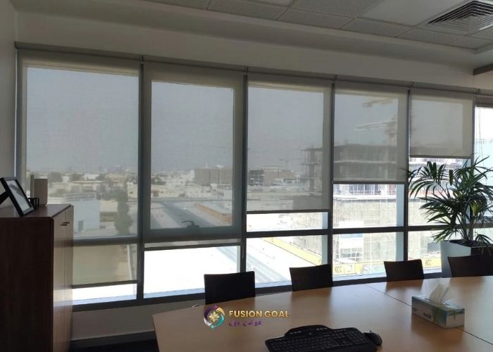 Sunscreen roller blinds helping reduce glare in an office