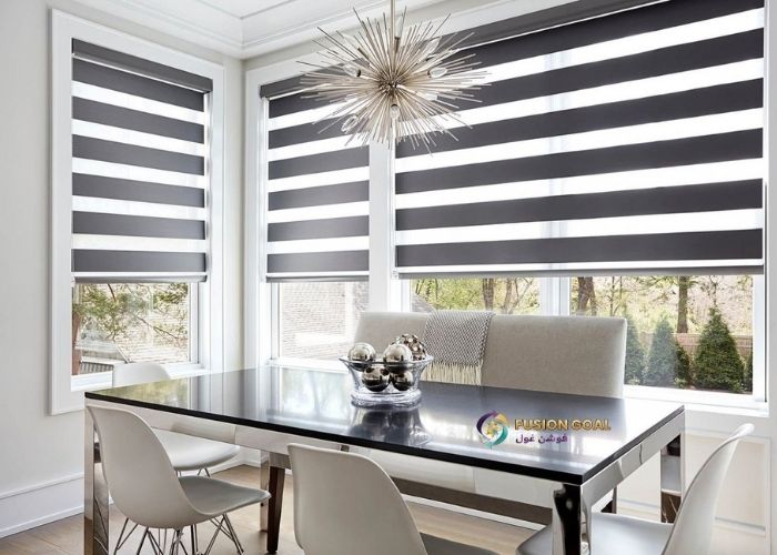 Zebra roller blinds with alternating sheer and opaque fabric in a office room